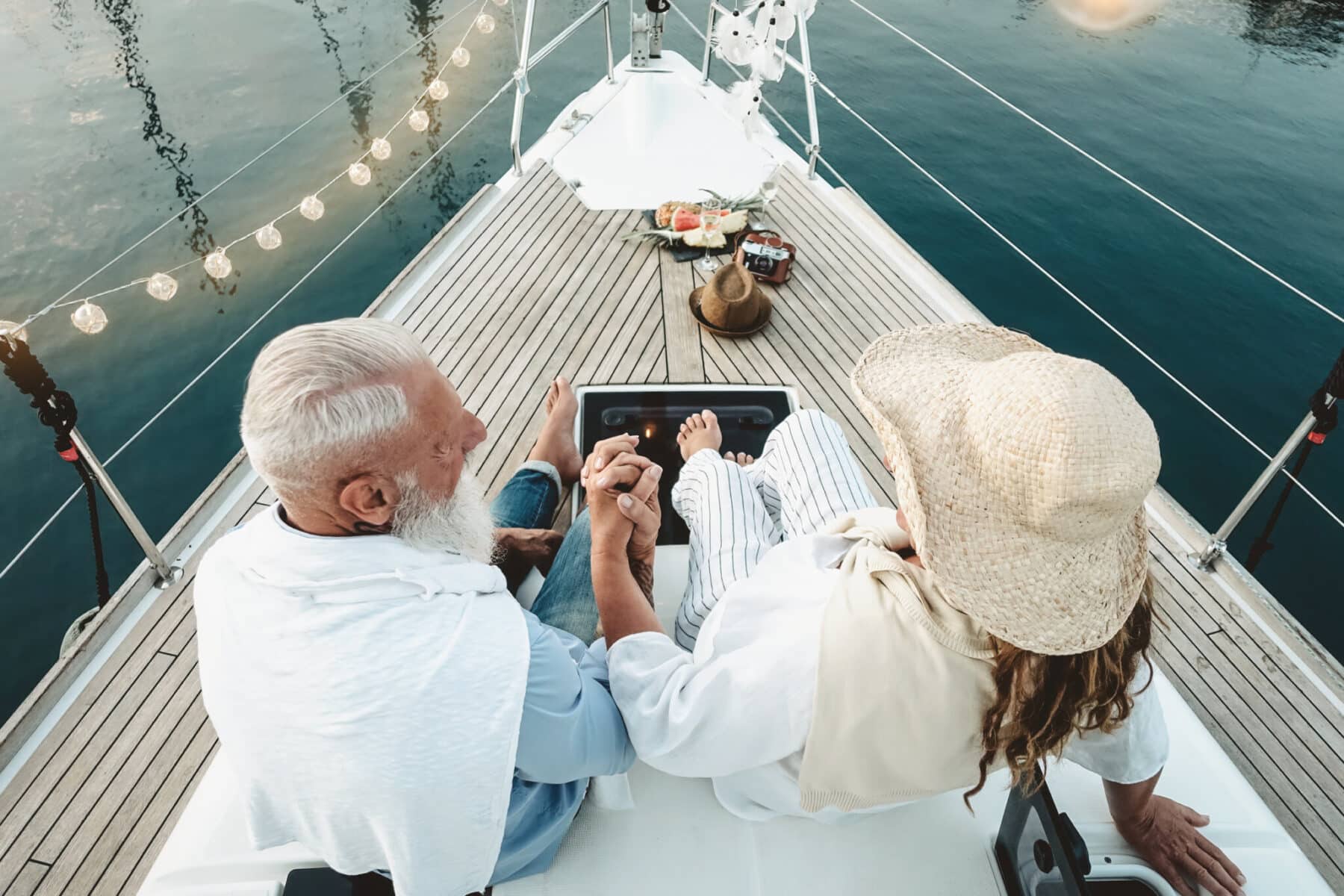 Senior,Couple,Celebrating,Wedding,Anniversary,On,Sailboat,-,Happy,Mature